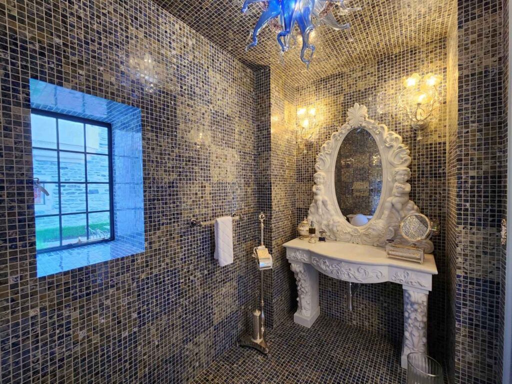 Luxury fixtures in powder room by Andrea D'Alessio