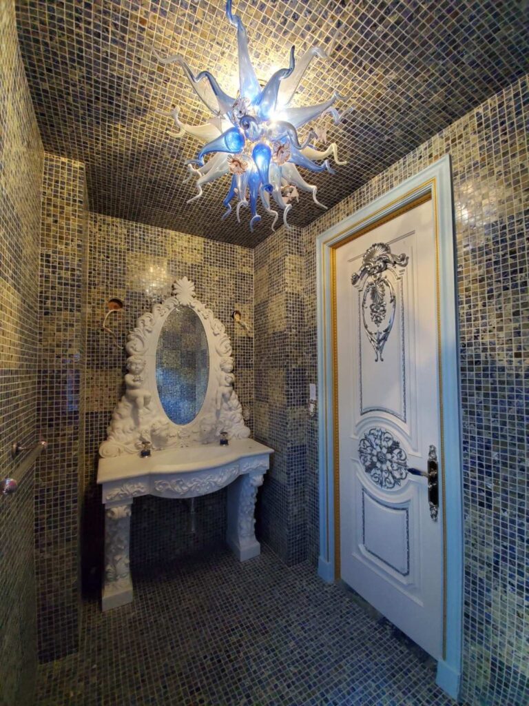 Decorative wall finish in powder room by Andrea D'Alessio